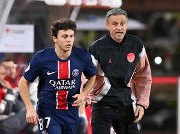 Paris St Germain coach Luis Enrique and Paris St Germain's Joao Neves 