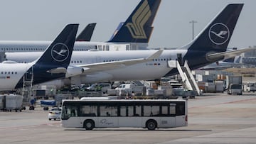 Lufthansa passenger aircraft stand on the apron of Frankfurt Airport.