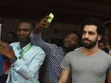 Liverpool and Egypt striker Mohamed Salah with club team mate Sadio Mané at the International Conference Centre in Accra, Ghana in Thursday's CAF awards ceremony.