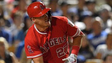 Mar 22, 2018; Phoenix, AZ, USA; Los Angeles Angels center fielder Mike Trout (27) runs to first after hitting a single against the Los Angeles Dodgers during the third inning at Camelback Ranch. Mandatory Credit: Joe Camporeale-USA TODAY Sports