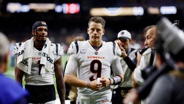 NEW ORLEANS, LOUISIANA - OCTOBER 16: Joe Burrow #9 and Ja'Marr Chase #1 of the Cincinnati Bengals walk off the field after defeating the New Orleans Saints 30-26 at Caesars Superdome on October 16, 2022 in New Orleans, Louisiana. (Photo by Chris Graythen/Getty Images)