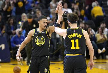 Jordan Poole #3 and Klay Thompson #11 of the Golden State Warriors 