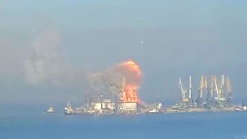 A handout picture released by the Ukrainian Navy on March 24, 2022 shows plumes of smoke and flames in the port of Berdyansk in the Azov Sea, 80 kilometres to the west of Mariupol, on the site where reportedly the large landing ship "Orsk" of the Russian Black Sea Fleet is docked. - Ukraine on March 23 said it had struck a Russian naval transport vessel docked in the Azov Sea near the besieged port city of Mariupol, a month into the Russian invasion. "The Orsk large landing ship of the Black Sea Fleet of the occupiers has been destroyed in the port of Berdyansk captured by Russia," the Ukrainian Navy wrote on social media. (Photo by Ukrainian Navy / AFP) / RESTRICTED TO EDITORIAL USE - MANDATORY CREDIT "AFP PHOTO /Ukrainian Navy " - NO MARKETING NO ADVERTISING CAMPAIGNS - DISTRIBUTED AS A SERVICE TO CLIENTS