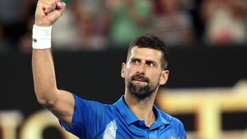 Serbia's Novak Djokovic celebrates victory over Spain's Carlos Alcaraz after their men's singles quarterfinal match on day ten of the Australian Open tennis tournament in Melbourne on January 22, 2025. (Photo by Martin KEEP / AFP) / -- IMAGE RESTRICTED TO EDITORIAL USE - STRICTLY NO COMMERCIAL USE --