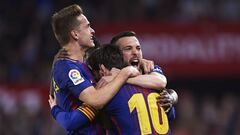 SEVILLE, SPAIN - MARCH 31: Lionel Messi of FC Barcelona celebrates after scoring the second goal of FC Barcelona with his team mates Denis Suarez of FC Barcelona (L) and Jordi Alba of FC Barcelona (R) during the La Liga match between Sevilla CF and FC Bar