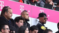 MUNICH, GERMANY - APRIL 14: Arturo Vidal of Bayern Muenchen (l) and Jerome Boateng of Bayern Muenchen (r) are seen in the stands during the Bundesliga match between FC Bayern Muenchen and Borussia Moenchengladbach at Allianz Arena on April 14, 2018 in Mun