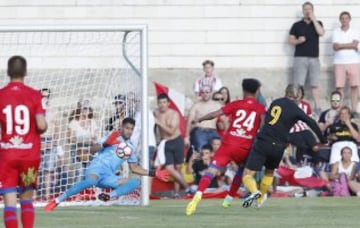 Fernando Torres puts Atleti ahead.