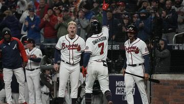 Atlanta Braves' Dansby Swanson celebrates his home run during the seventh inning in Game 4 of baseball's World Series between the Houston Astros and the Atlanta Braves Saturday, Oct. 30, 2021, in Atlanta. (AP Photo/Ashley Landis)