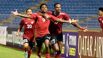 Trinidad and Tobago's midfielder #09 Nathaniel James (C) celebrates scoring his team's third goal with teammates defender #17 Justin Garcia (R) and midfielder #20 Kaile Auvray (L) during the CONCACAF Nations League group A football match between Trinidad and Tobago and Guatemala at Hasely Crawford stadium in Port of Spain, Trinidad and Tobago on October 13, 2023. (Photo by Robert TAYLOR / AFP)