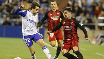 Delmás intenta frenar a Merquelanz.