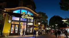 (FILES) In this file photo taken on November 19, 2020 people wait in line to enter a store as people visit Disneyland where parts of the park opened today for more retail and dining as an extension of the Downtown Disney District in Anaheim, California. - California will fully reopen by June 15 if the current rate of vaccinations continues, lifting all Covid-related restrictions on businesses and gatherings, Governor Gavin Newsom said on April 6, 2021. The nation&#039;s most populous state has now administered 20 million vaccine doses, and will end its tier-based reopening blueprint if there are no spikes or vaccine shortages. &quot;We are announcing today that on June 15... we&#039;ll be getting rid of the blueprint, as you know it today. That&#039;s on June 15 if we continue the good work,&quot; said Newsom, adding that mask-wearing requirements would remain. (Photo by Frederic J. BROWN / AFP)