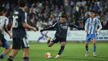 Real Madrid's French forward #10 Kylian Mbappe scores his team's third goal during the Spanish Copa del Rey (King's Cup) round of 32 second leg football match between Talavera CF and Real Madrid CF at El Prado Municipal Stadium in Talavera de la Reina on December 17, 2025. (Photo by Thomas COEX / AFP)