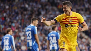 Barcelona's Polish forward Robert Lewandowski celebrates scoring the opening goal during the Spanish league football match between RCD Espanyol and FC Barcelona at�the RCDE Stadium in Cornella de Llobregat on May 14, 2023. (Photo by Lluis GENE / AFP)