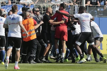 Bastia fans invade the pitch at the Armand Cesari stadium.