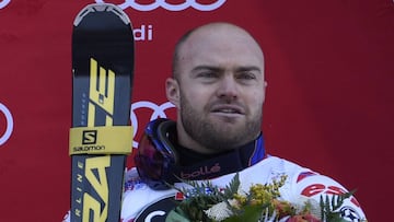 Third-placed France&#039;s David Poisson celebrates on the podium of the FIS Alpine World Cup Men&#039;s Downhill in Santa Caterina Valfurva, Northern Italy, on December 29, 2015.  AFP PHOTO / OLIVIER MORIN