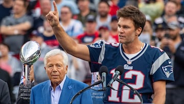 Former New England Patriots quarterback Tom Brady (R) gestures, flanked by CEO of the New England Patriots Robert Kraft, as he speaks to fans as he is honored during halftime of the season-opening game between the Patriots and the Philadelphia Eagles at Gillette Stadium in Foxborough, Massachusetts, on September 10, 2023. Tom Brady played for 20 seasons with the New England Patriots. (Photo by Joseph Prezioso / AFP)