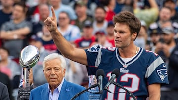 Former New England Patriots quarterback Tom Brady (R) gestures, flanked by CEO of the New England Patriots Robert Kraft, as he speaks to fans as he is honored during halftime of the season-opening game between the Patriots and the Philadelphia Eagles at Gillette Stadium in Foxborough, Massachusetts, on September 10, 2023. Tom Brady played for 20 seasons with the New England Patriots. (Photo by Joseph Prezioso / AFP)