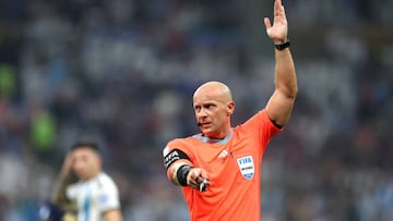 LUSAIL CITY, QATAR - DECEMBER 18: Referee Szymon Marciniak gestures during the FIFA World Cup Qatar 2022 Final match between Argentina and France at Lusail Stadium on December 18, 2022 in Lusail City, Qatar. (Photo by Maja Hitij - FIFA/FIFA via Getty Images)
