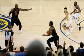 OAKLAND, CA - MAY 31: JR Smith #5 of the Cleveland Cavaliers dribbles in the closing seconds of regulation as LeBron James #23 attempts direct the offense against the Golden State Warriors in Game 1 of the 2018 NBA Finals at ORACLE Arena on May 31, 2018 in Oakland, California.