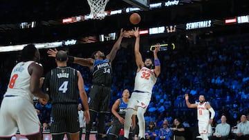 Dec 13, 2025; Las Vegas, Nevada, USA; New York Knicks center Karl-Anthony Towns (32) shoots over Orlando Magic center Wendell Carter Jr. (34) during the second quarter at T-Mobile Arena. Mandatory Credit: Kirby Lee-Imagn Images