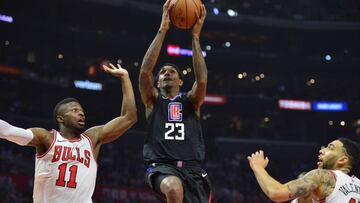 February 3, 2018; Los Angeles, CA, USA; Los Angeles Clippers guard Lou Williams (23) moves to the basket against Chicago Bulls guard David Nwaba (11) and forward Denzel Valentine (45) during the first half at Staples Center. Mandatory Credit: Gary A. Vasquez-USA TODAY Sports