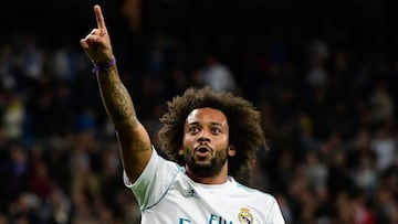 Real Madrid's Brazilian defender Marcelo celebrates after scoring his team's third goal during the Spanish league football match Real Madrid CF vs SD Eibar at the Santiago Bernabeu stadium in Madrid on October 22, 2017. / AFP PHOTO / PIERRE-PHIL