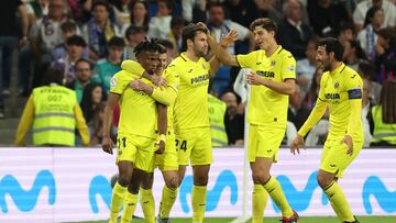 Villarreal's Nigerian midfielder Samuel Chukwueze (L) celebrates scoring his team's third goal during the Spanish league football match between Real Madrid CF and Villarreal CF at the Santiago Bernabeu stadium in Madrid on April 8, 2023. (Photo by Pierre-Philippe MARCOU / AFP)