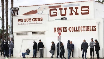 LOS ANGELES, CALIFORNIA - MARCH 15: People stand in line outside the Martin B. Retting, Inc. guns store on March 15, 2020 in Culver City, California. The spread of COVID-19 has prompted some Americans to line up for supplies in a variety of stores. Mari