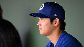 SURPRISE, ARIZONA - FEBRUARY 28: Shohei Ohtani #17 of the Los Angeles Dodgers looks on from the dugout against the Texas Rangers during a spring training game at Surprise Stadium on February 28, 2024 in Surprise, Arizona.   Norm Hall/Getty Images/AFP (Photo by Norm Hall / GETTY IMAGES NORTH AMERICA / Getty Images via AFP)