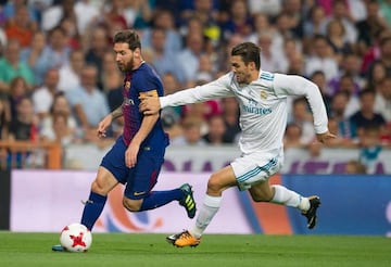 Kovacic (right) tussles with Barcelona's Lionel Messi during Wednesday's Spanish Super Cup second leg.