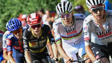 (FILES) Team Visma - Lease a bike team's Danish rider Jonas Vingegaard (center L) and UAE Team Emirates - XRG team's Slovenian rider Tadej Pogacar (center R) cycle in the ascent of Col des Borderes during the 12th stage of the 112th edition of the Tour de France cycling race, 180.6 km between Auch and Hautacam, in the Pyrenees mountains of southwestern France, on July 17, 2025. (Photo by Loic VENANCE / AFP)