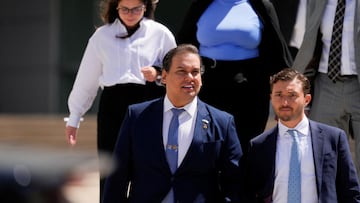 George Santos, who was expelled from the U.S. House of Representatives, leaves court alongside his attorney Andrew Mancilla in Long Island after his corruption trial in Central Islip, New York, U.S. August 13, 2024. REUTERS/Adam Gray