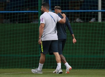 Neymar Jr leaves training with the physiotherapist Bruno Mazziotti during a training session at Yug-Sport Stadium on June 19, 2018 in Sochi.