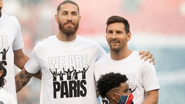 New signings, Sergio Ramos and Lionel Messi of Paris Saint-Germain pose for a photo as they are introduced to the fans prior to the Ligue 1 Uber Eats match between Paris Saint Germain and Strasbourg at Parc des Princes on August 14, 2021 in Paris, France.