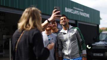 Tennis - Wimbledon - Preview - All England Lawn Tennis and Croquet Club, London, Britain - July 2, 2023 Serbia's Novak Djokovic takes a selfie with fans ahead of Wimbledon REUTERS/Hannah Mckay