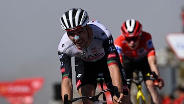 Team UAE's Portuguese rider Joao Almeida crosses first the finish line of the 13th stage of the Vuelta a Espana, a 202 km race between Cabezon de la Sal and L'Angliru, on September 5, 2025. (Photo by Miguel RIOPA / AFP)