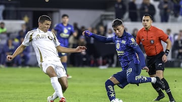 Sergi Palencia (L) of Los Angeles fights for the ball with Cristian Calderon (R) of America during the match between Los Angeles FC and America as part of the friendly match, at Banc of California Stadium on February 11, 2025 in Los Angeles, California, United States.