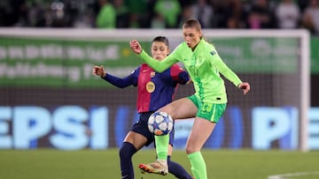 Wolfsburg's German midfielder #29 Jule Brand and Barcelona's Spanish defender #05 Jana Fernandez vie for the ball during the UEFA Women's Champions League quarter-final first-leg football match VfL Wolfsburg v FC Barcelona in Wolfsburg, northern Germany, on March 19, 2025. (Photo by RONNY HARTMANN / AFP)