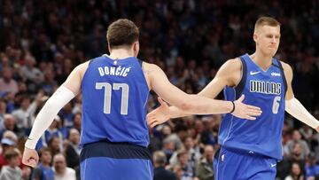 Mar 4, 2020; Dallas, Texas, USA; Dallas Mavericks guard Luka Doncic (77) and Dallas Mavericks forward Kristaps Porzingis (6) celebrate during the second half against the New Orleans Pelicans at American Airlines Center. Mandatory Credit: Kevin Jairaj-USA TODAY Sports