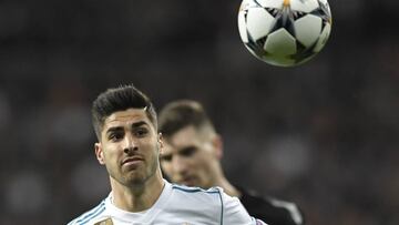 Real Madrid&#039;s Spanish midfielder Marco Asensio eyes the ball during the UEFA Champions League round of sixteen first leg football match Real Madrid CF against Paris Saint-Germain (PSG) at the Santiago Bernabeu stadium in Madrid on February 14, 2018. 