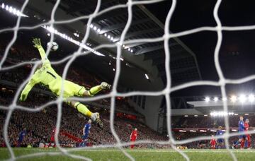 Manchester United's David De Gea saves from Liverpool's Philippe Coutinho