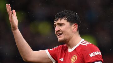 Manchester United's English defender Harry Maguire reacts during the English Premier League football match between Manchester United and Southampton at Old Trafford in Manchester, north west England, on February 12, 2022. (Photo by Oli SCARFF / AFP) / RESTRICTED TO EDITORIAL USE. No use with unauthorized audio, video, data, fixture lists, club/league logos or 'live' services. Online in-match use limited to 120 images. An additional 40 images may be used in extra time. No video emulation. Social media in-match use limited to 120 images. An additional 40 images may be used in extra time. No use in betting publications, games or single club/league/player publications. /