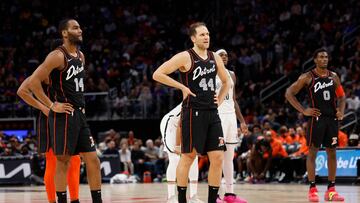 Detroit Pistons guard Alec Burks (14), forward Bojan Bogdanovic (44), and center Jalen Duren (0) look on during the second half against the Brooklyn Nets at Little Caesars Arena.