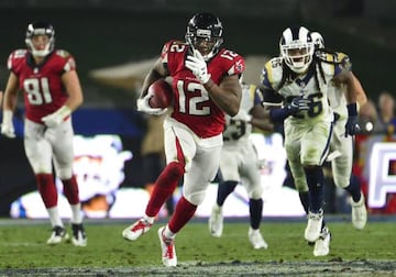 Atlanta Falcons wide receiver Mohamed Sanu (12) runs the ball after making a reception against the Los Angeles Rams during the second half in the NFC Wild Card playoff football game at the Los Angeles Memorial Coliseum.