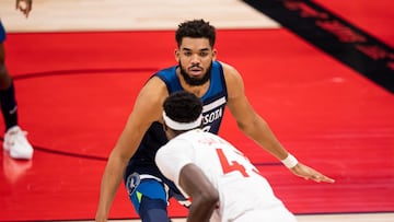 Feb 14, 2021; Tampa, Florida, USA; Minnesota Timberwolves center Karl-Anthony Towns (32) guards Toronto Raptors forward Pascal Siakam (43) during the fourth quarter of a game between the Toronto Raptors and the Minnesota Timberwolves at Amalie Arena. Mandatory Credit: Mary Holt-USA TODAY Sports