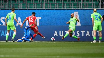 Bayern Munich&#039;s Cameroonian forward Eric Maxim Choupo-Moting (C) scores the 2-0 goal during the German first division Bundesliga football match between VfL Wolfsburg and FC Bayern Munich in Wolfsburg, northern Germany, on April 17, 2021. (Photo by FA