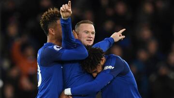 Everton&#039;s English striker Wayne Rooney (C) celebrates scoring his third goal to complete his hattrick during the English Premier League football match between Everton and West Ham United at Goodison Park in Liverpool, north west England on November 2