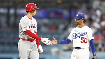 Shohei Ohtani saluting a Dodgers player.