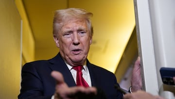 U.S. President Donald Trump speaks to members of the media onboard Air Force One, on a flight to Joint Base Andrews in Maryland, U.S. April 13, 2025. REUTERS/Nathan Howard