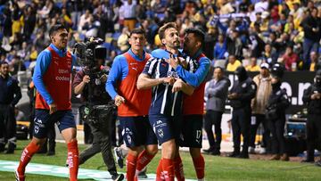 Monterrey's Spanish midfielder #10 Sergio Canales (2nd R) celebrates with teammates after scoring during the Liga MX Apertura tournament final first-leg football match between America and Monterrey at the Cuauhtemoc Stadium in Puebla, Mexico, on December 12, 2024. (Photo by CARL DE SOUZA / AFP)